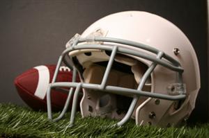 How does the air pressure in a football helmet affect cushioning?
